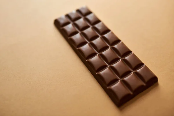 stock image Life happens, chocolate helps. Studio shot of a slab of chocolate against a brown background