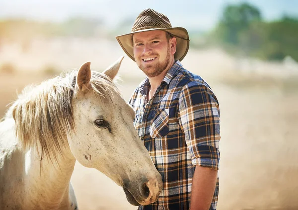 stock image Come have a look what we have to offer. a farmer standing with his horse