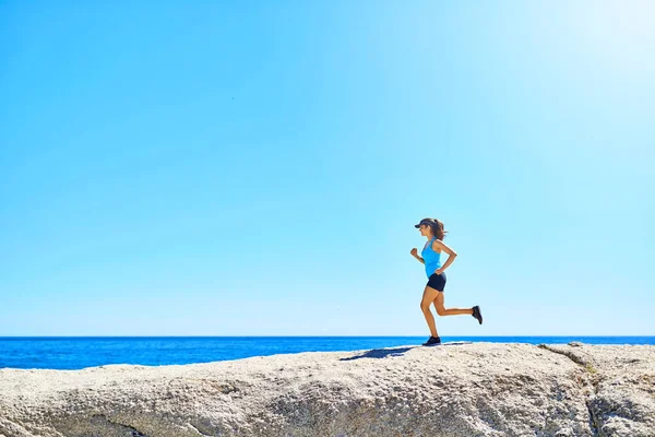 stock image Find it inside yourself to go out and keep going. a young woman out running