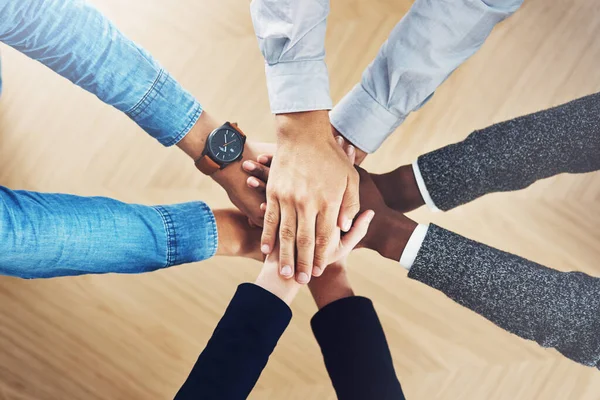 Stock image Above, mission or hands of business people in support for faith, teamwork or partnership in office. Vision, diversity or employees in group collaboration with hope or strategy for goals together.