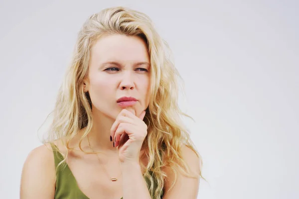 stock image Young woman, thinking and confused in studio with ideas, memory and focus by gray background. Girl, model and think with concentration, remember and decision for choice, planning or question on mind.