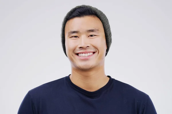 stock image Face portrait, smile and Asian man in beanie in studio isolated on a white background. Happy, handsome and male person from Japan with confidence, fashion and stylish aesthetic for positive mindset