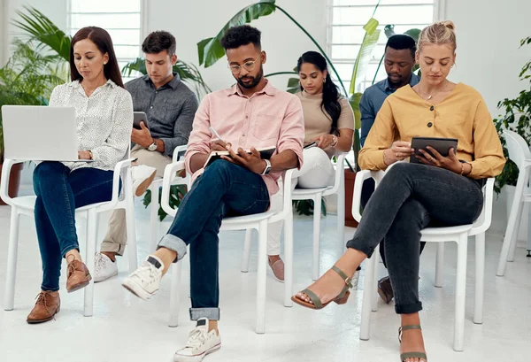 stock image Ready for the presentation. a diverse group of businesspeople sitting together for a presentation in the office