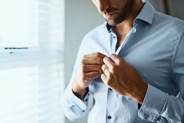 stock image Closeup, man and button shirt of clothes for job interview, work and corporate fashion for business. Hands of male person getting ready in professional outfit from wardrobe in the morning at home.