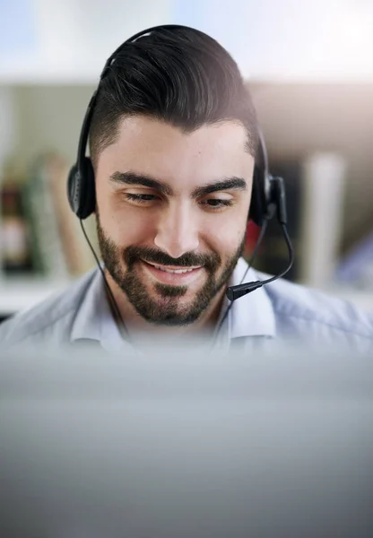 stock image Communication, face or happy man in call center consulting, speaking or talking at customer services. Virtual assistant, friendly or sales consultant in telemarketing or telecom company help desk.