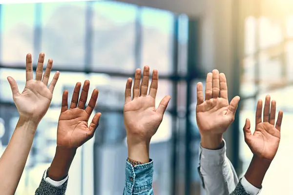 stock image Willing to lend a helping hand. a group of unrecognizable businesspeople raising their hands