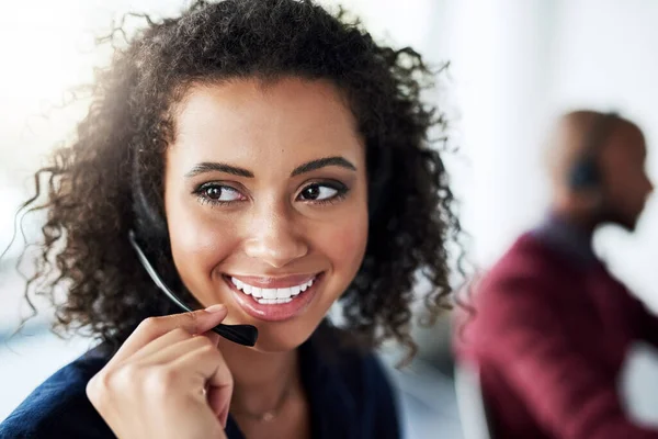 Call center agent and woman with a smile, thinking and telemarketing with client service, help and speaking. Female person, happy employee and consultant with headphones, tech support and happiness.