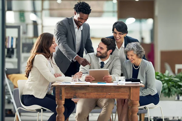 Business people, tablet or black man talking in meeting for ideas, strategy or planning a startup company. Digital, teamwork or employees in group discussion or speaking for online growth in office.