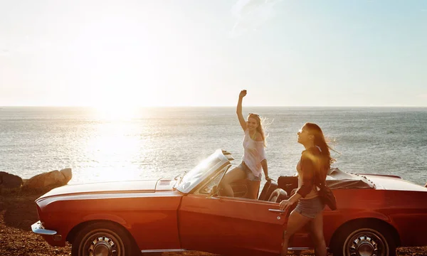 stock image Do it for the beautiful destinations. a two happy young women enjoying a summers road trip together