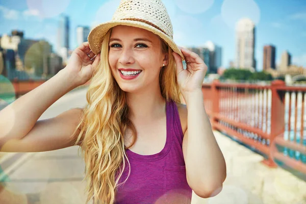 stock image Life in the city is good. a smiling young woman walking around the city in the summertime