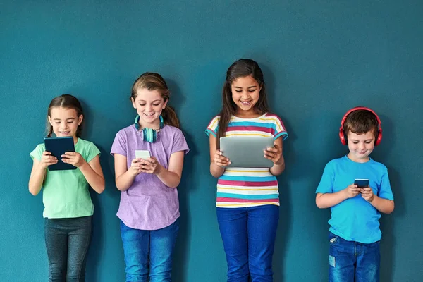More Mobile Ever Studio Shot Group Kids Using Wireless Technology — Fotografia de Stock