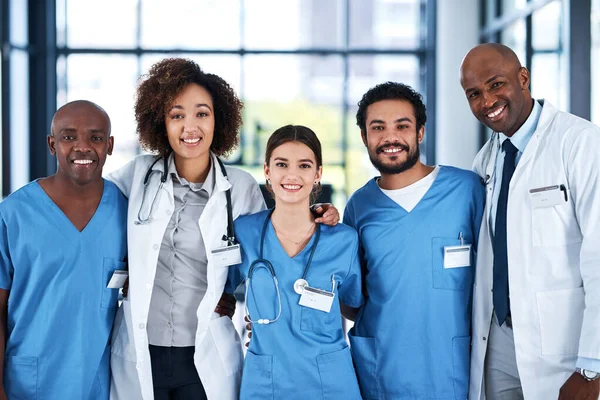 We care for and support one another too. Portrait of a group of medical practitioners standing together in a hospital