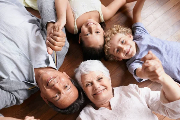 Portrait Holding Hands Grandparents Floor Happy Kids Smiling Together Family — Stock Photo, Image