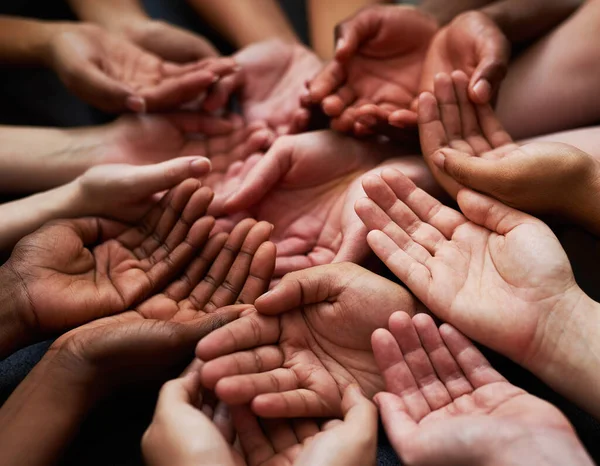 stock image People, diversity and open palm with support in a community with unity and care. Group, helping and hands together for charity with donation and global solidarity for poverty with diverse team