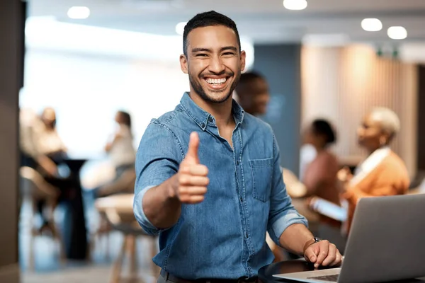 stock image Portrait, business and man with a laptop, thumbs up and internet connection in a modern office, smile and agreement. Face, male person and employee with a pc, technology and professional with support.