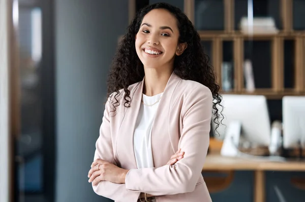 Portrait of happy business woman with arms crossed in legal office with confidence and happiness. Smile, professional female lawyer and boss at law firm, young corporate workplace manager in Brazil
