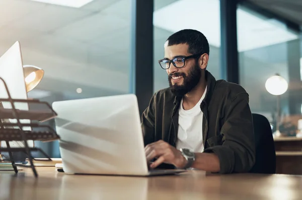 stock image Smile, work and a businessman with a laptop for an email, communication or online coding. Happy, programming and a male programmer typing on a computer for web or software development in an office.