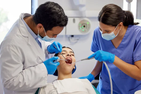 Getting right down to the root cause. a young woman having a dental procedure performed on her