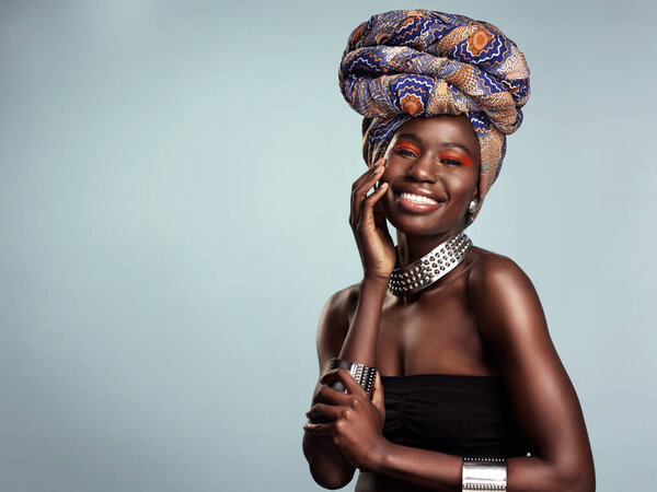 Smile, black woman and portrait with African head wrap and beauty in a studio. Isolated, grey background traditional Africa turban with a young face and female model with culture pride and mockup.