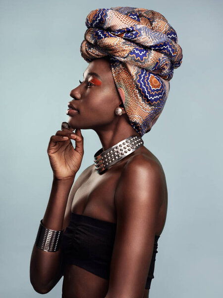 Fashion, head scarf and profile of black woman in studio on gray background with glamour, cosmetics and makeup. Luxury, culture and face of female person in exotic jewelry, African style and beauty.
