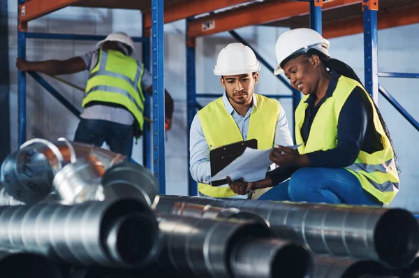 Cant Find Two Young Contractors Crouched Warehouse Having Discussion While — Stock Photo, Image
