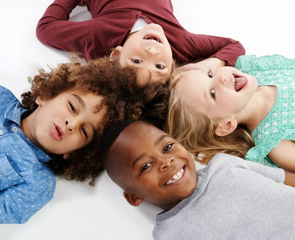 Circle Happiness Studio Shot Group Young Friends Lying Floor Together — Stock Photo, Image
