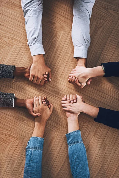 stock image Above, diversity or business people holding hands for support, team building or teamwork in office. Partnership, zoom or employees in group collaboration with solidarity or mission for goals together.