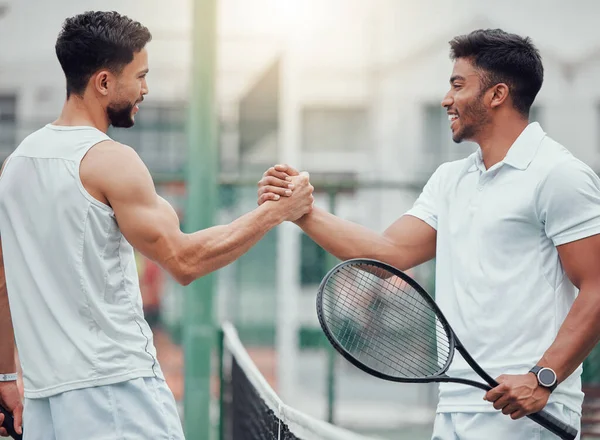 Happy man, tennis and friends in handshake for partnership, fitness or deal in competition or game on court. Men shaking hands for sports training, teamwork or support in friendly match or agreement.