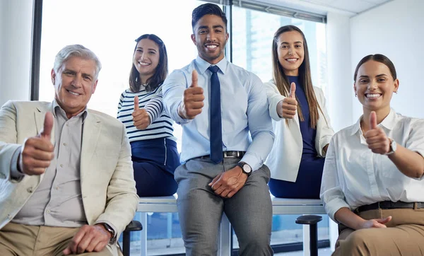 Business people, together and thumbs up in office portrait for agreement, motivation or diversity. Men, women and teamwork with yes, icon or emoji in solidarity, smile or support at finance agency.