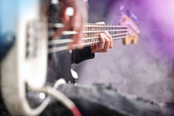 Guitar, smoke and man hands at music festival show playing rock with electric instrument with mockup. Sound, musician and party with live talent and audio for punk event with people at a concert.