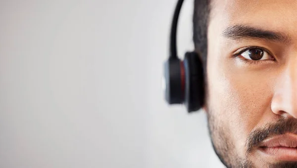 Portrait of man, mockup or virtual assistant in call center tech support consulting in telemarketing in headset. Mock up space, face or serious consultant in telecom sales with headphones in studio.