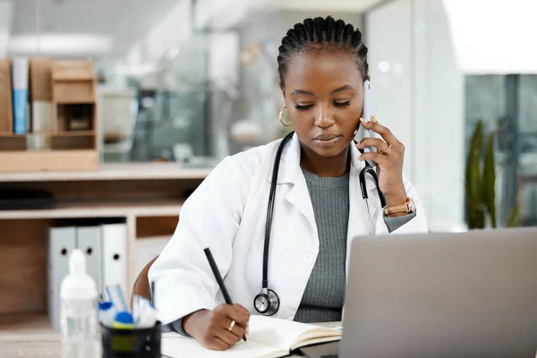 Phone call, doctor and black woman writing notes for medical planning, schedule and agenda. Healthcare, clinic and female worker talking on smartphone for consulting, medicare service and discussion.