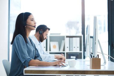 Call center, people and team in customer service, support or telemarketing on computer at the office. Woman and man consultant, agent or virtual assistant working for online agency at the workplace. clipart