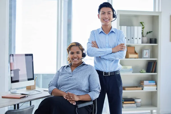 Call center, happy and portrait of business people in office for customer service, contact us and telemarketing. Smile, advice and help desk with Asian man and woman for communication and networking.