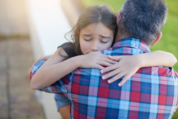 Hug, father and girl with love, sympathy and comfort with grief, loss and depression with pain. Family, female child or male parent with kid, daughter or dad embrace, sad or care with anxiety or fear.