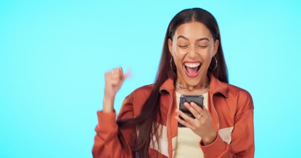 Woman Smartphone Fist Pump Celebration Happiness Bonus Winning Blue Background — Stock Video