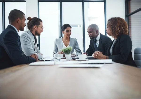 Effective meetings is the most important ingredient in team success. a group of businesspeople having a meeting in the boardroom