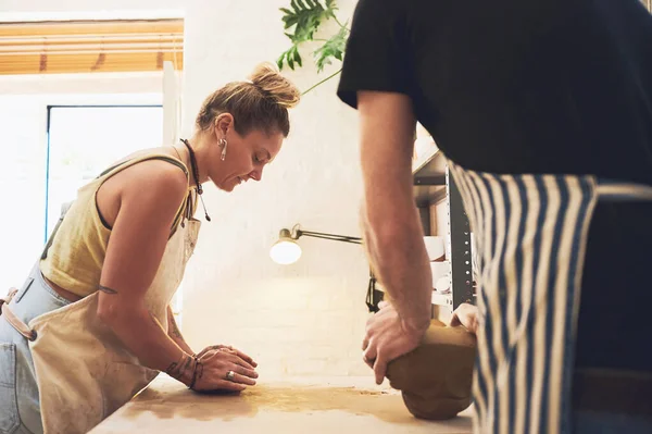 stock image Dedicate time everyday to nurturing your creativity. a young woman kneading clay in a pottery studio