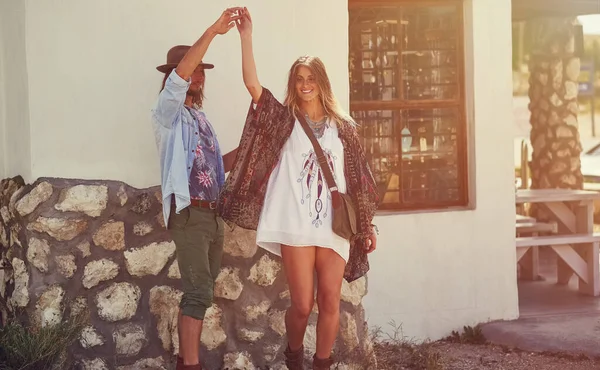 stock image They dont need a reason to dance. an affectionate young couple dancing outside a roadside shop