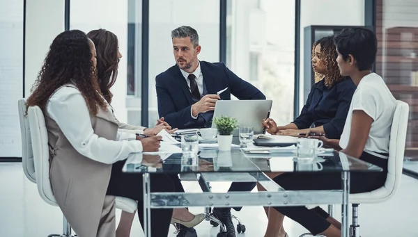 stock image Staying on track with focus and determination. a group of colleagues having a meeting in a modern office