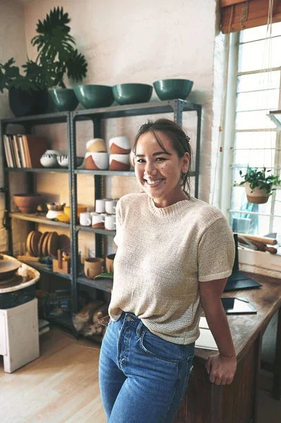 Can you tell this is my comfort zone. Cropped portrait of an attractive young business owner standing alone in her pottery studio during the day