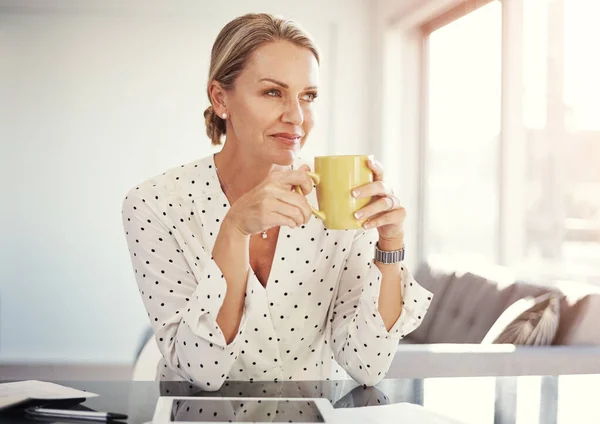 stock image Coffee at home then work from home. a mature businesswoman working from her home office