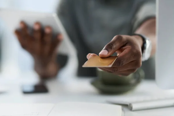 stock image Man, hands and credit card in finance for ecommerce, payment or internet banking on office desk. Hand of male person showing debit for online shopping, purchase or wireless transaction at workplace.