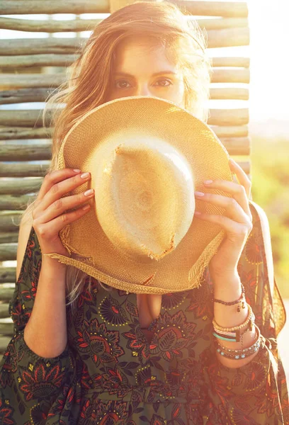 stock image I hat nothing to say. a young woman holding a hat over her face