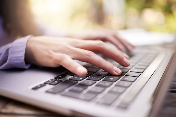 stock image Typing, woman hands and laptop in garden for university research, college application or remote work outdoor. Park, search and person or student on computer of e learning, online education and study.