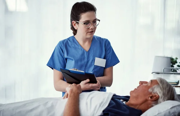 Anything Else You Need Female Carer Assisting Her Male Patient — Stock Photo, Image