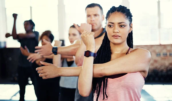 Change Focused Group Young People Standing Row Stretching Workout Session — Stock Photo, Image