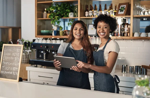 Happy woman, tablet and portrait of waitress team at cafe for inventory, checking stock or order at restaurant. Barista women or small business teamwork on technology at coffee shop in online service.