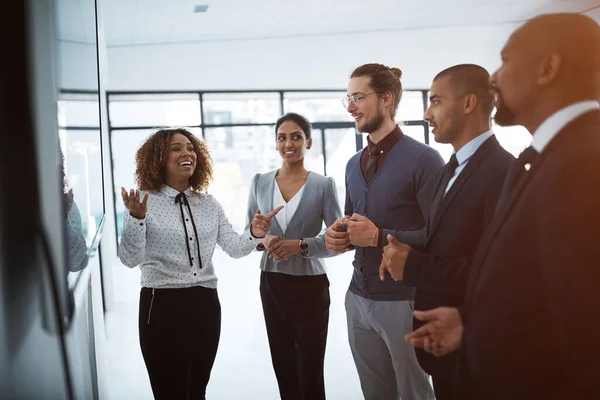 Stock image She has a vision for this company. a young businesswoman giving a presentation in the boardroom