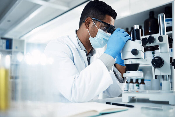 Man, scientist and microscope, analysis and check DNA sample with science experiment in laboratory. Male doctor with mask, gloves and analyze data with scientific innovation and medical research.